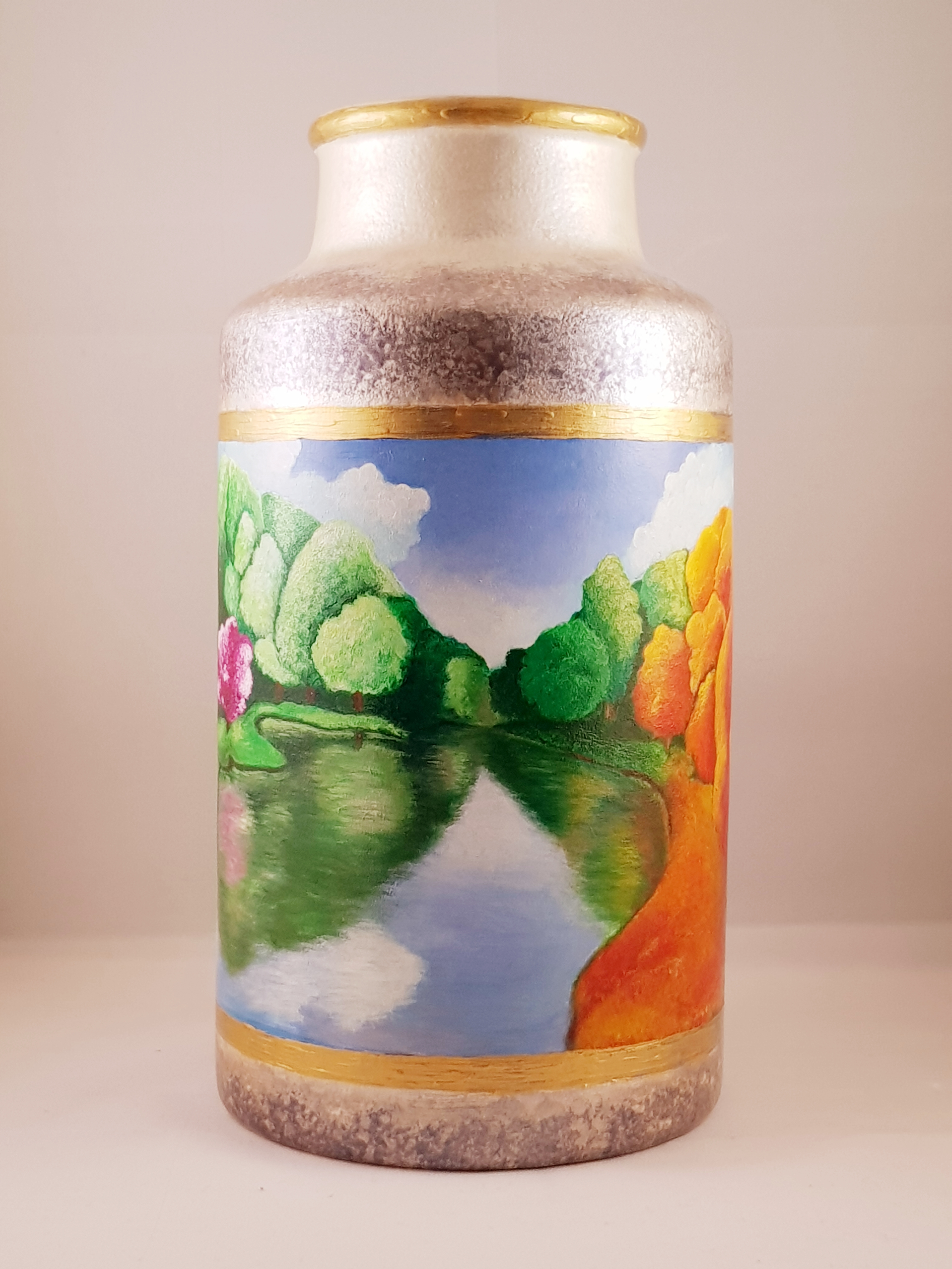 Painted seasons, lake reflection on ceramic vase.